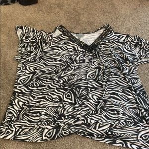 We have this black and white blouse